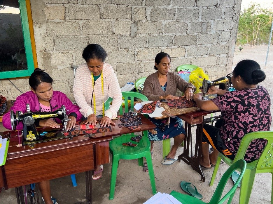 Women learning tailoring skills at Nekaf Mese